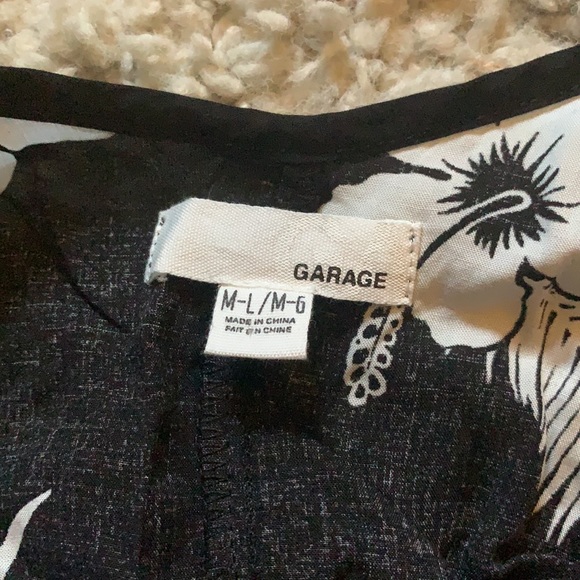 Black and white flowy, strapy, tank with flower design - Picture 3 of 3